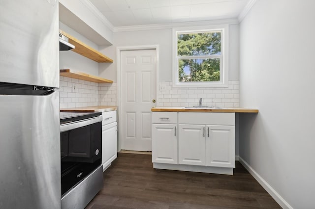 kitchen with decorative backsplash, stainless steel appliances, dark wood-type flooring, sink, and white cabinetry