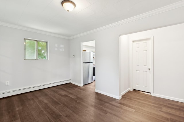 unfurnished room with crown molding, baseboard heating, and dark wood-type flooring