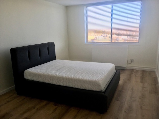 bedroom with wood-type flooring