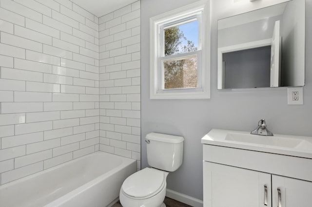 full bathroom with vanity, toilet, and tiled shower / bath