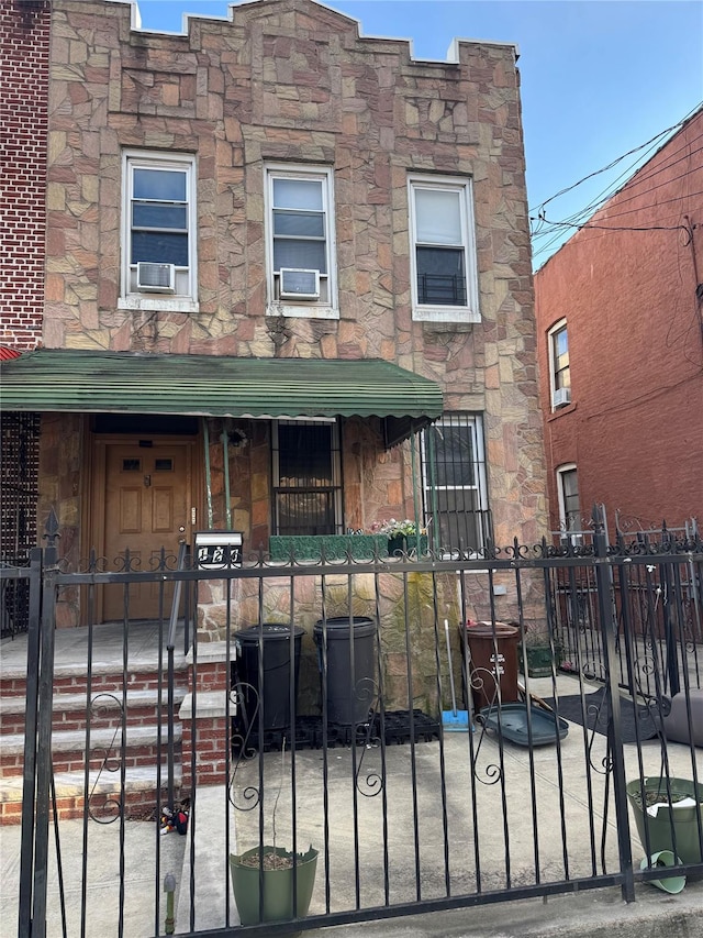 view of front of property featuring cooling unit