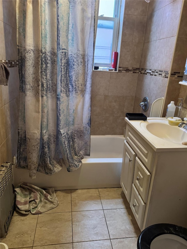 bathroom featuring shower / bath combination with curtain, vanity, and tile patterned floors