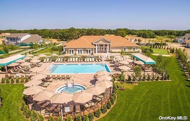 view of swimming pool featuring a lawn