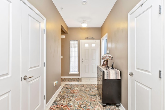 entrance foyer with light tile patterned floors