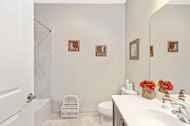 bathroom with toilet, vanity, and tile patterned floors