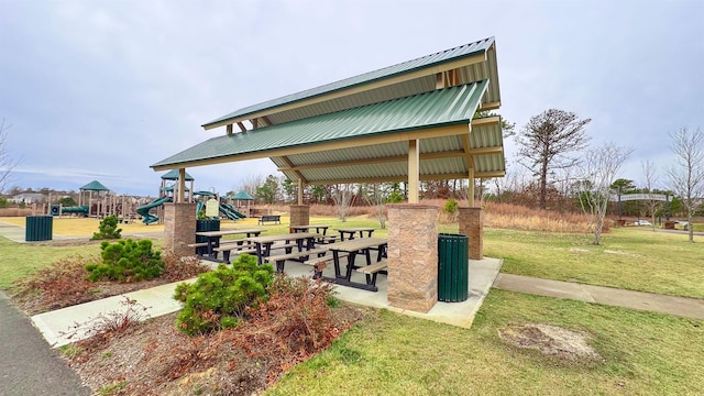 surrounding community featuring a playground and a yard