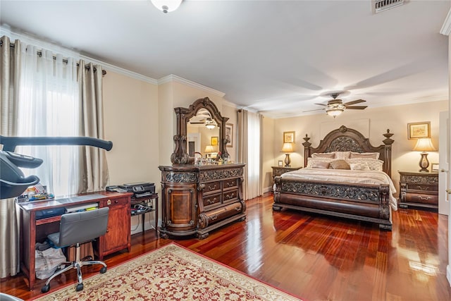 bedroom featuring ceiling fan, crown molding, and dark wood-type flooring