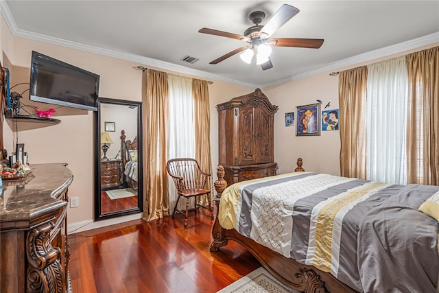 bedroom featuring ceiling fan, crown molding, and dark hardwood / wood-style floors