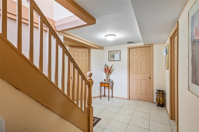 foyer entrance featuring light tile patterned floors