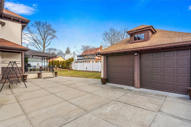 garage featuring a yard