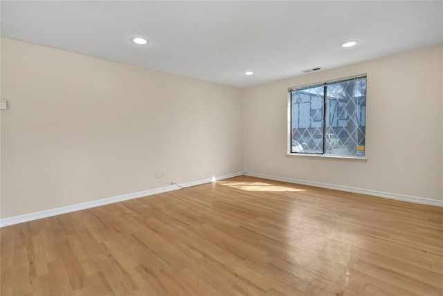 unfurnished room featuring light hardwood / wood-style floors