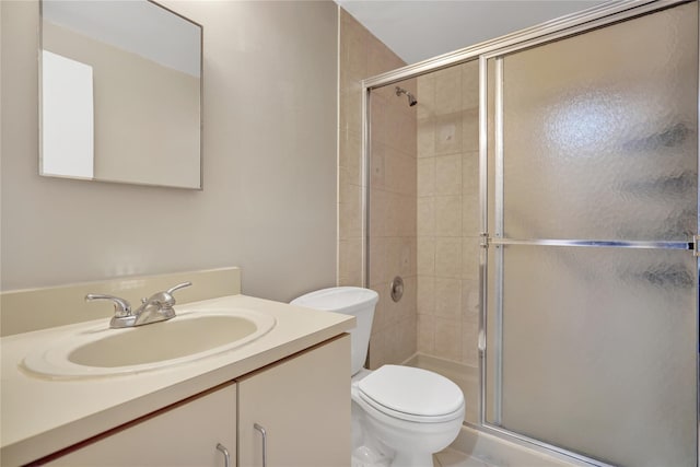 bathroom with walk in shower, vanity, and toilet