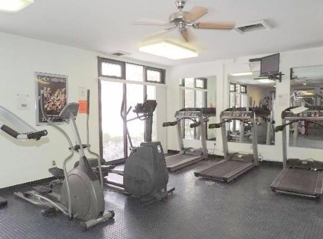 exercise room with ceiling fan