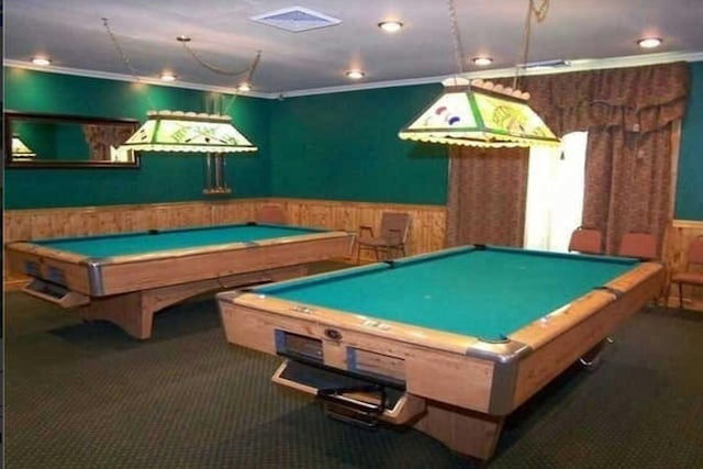 rec room with crown molding, dark carpet, and billiards