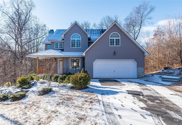 front of property with covered porch and a garage