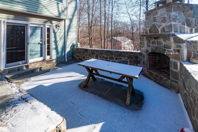 view of patio featuring an outdoor stone fireplace