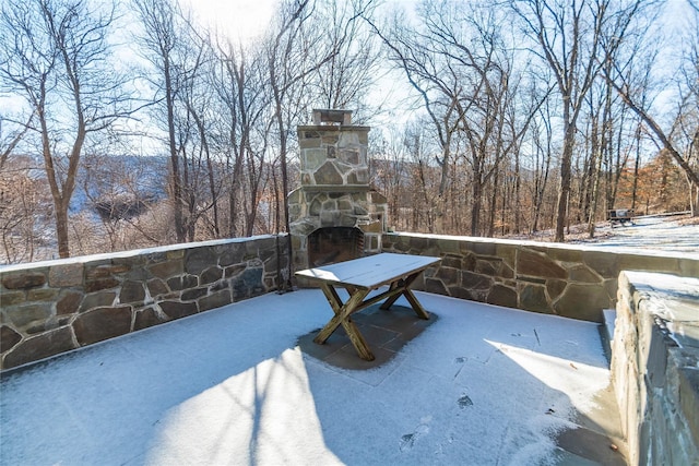 view of patio with an outdoor stone fireplace