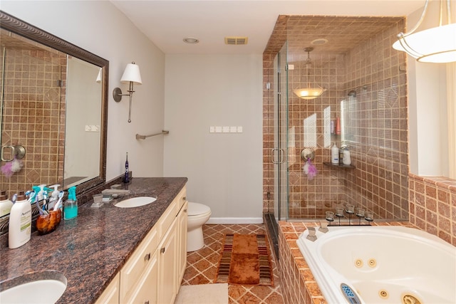 full bathroom featuring plus walk in shower, vanity, tile patterned floors, and toilet