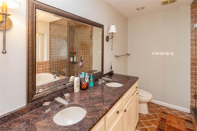 bathroom with a tub, tile patterned flooring, vanity, and toilet