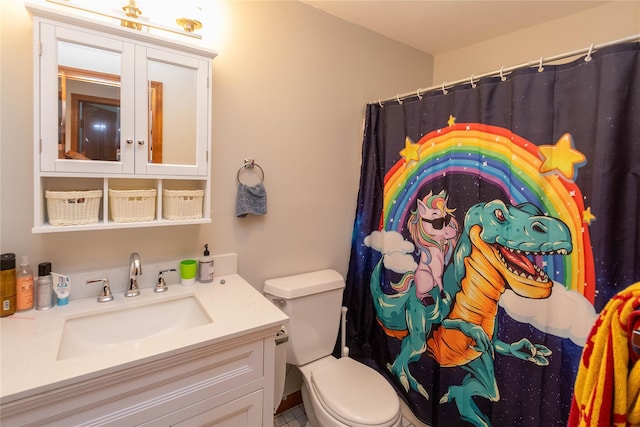 bathroom with vanity, curtained shower, and toilet