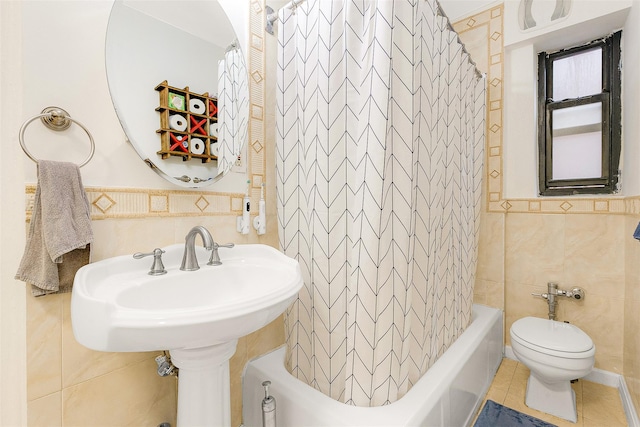 bathroom featuring tile patterned flooring, toilet, tile walls, and shower / tub combo