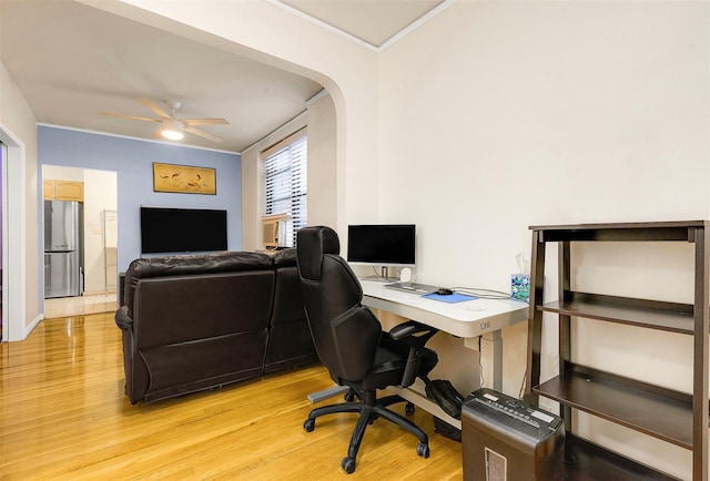 office with ceiling fan, light wood-type flooring, and ornamental molding