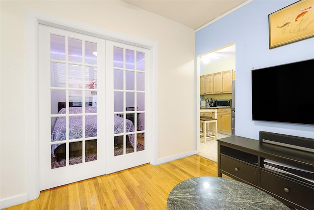 doorway with light hardwood / wood-style flooring and french doors