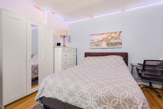 bedroom featuring a closet and light hardwood / wood-style flooring