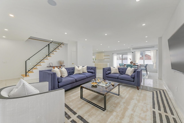 living room with light tile patterned floors and an AC wall unit