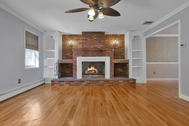 unfurnished living room with baseboard heating, light wood-type flooring, built in features, and a fireplace