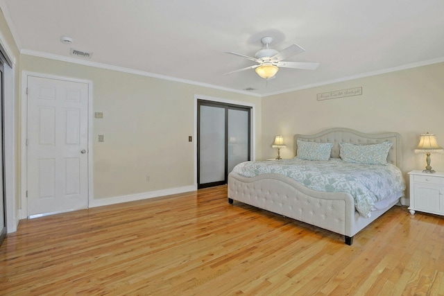 bedroom featuring ceiling fan, light hardwood / wood-style flooring, and ornamental molding