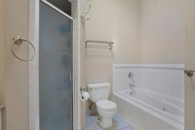 bathroom featuring toilet, tile patterned flooring, and shower with separate bathtub