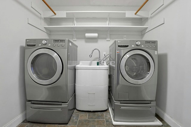 laundry area featuring washing machine and clothes dryer