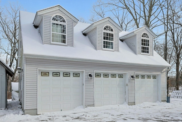 view of snow covered garage