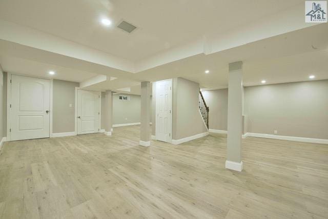 basement featuring light hardwood / wood-style flooring