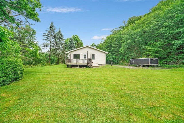 view of yard with a wooden deck