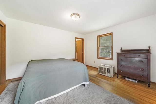 bedroom with hardwood / wood-style floors