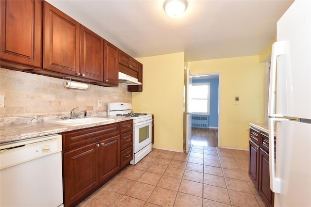 241-20 Northern Blvd Unit 6E, Douglaston, NY 11362 - kitchen featuring white appliances, radiator heating unit, tasteful backsplash, under cabinet range hood, and light tile patterned floors