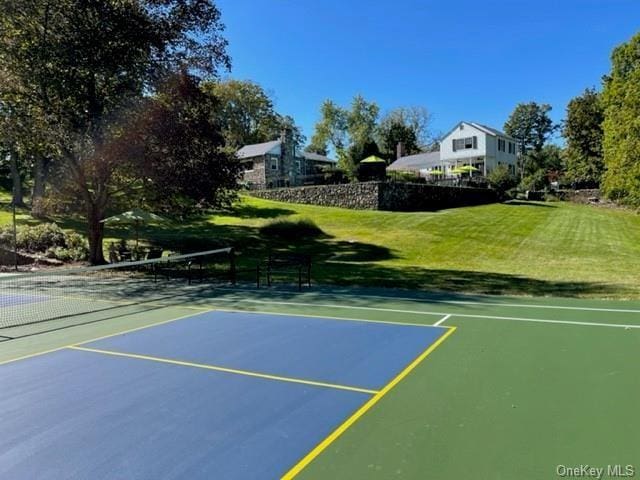 view of basketball court with a lawn and tennis court