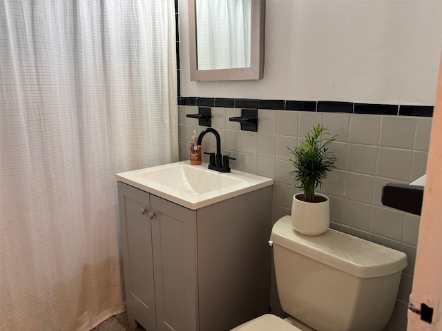 2295 Palmer Ave Unit 1P, New Rochelle, NY 10801 - bathroom with vanity, tile walls, toilet, and a shower with shower curtain