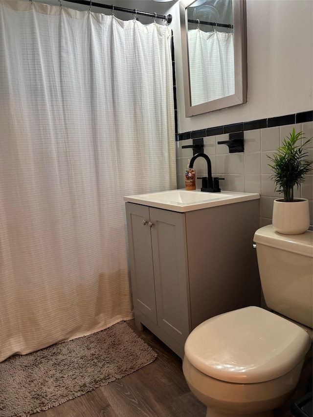 2295 Palmer Ave Unit 1P, New Rochelle, NY 10801 - bathroom with vanity, wood finished floors, toilet, tile walls, and a shower with curtain