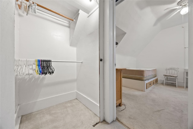 bathroom featuring ceiling fan and lofted ceiling