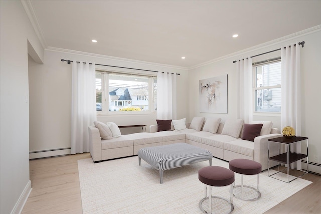 living room featuring ornamental molding, a baseboard radiator, and light hardwood / wood-style flooring