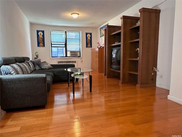 living room with light wood-type flooring and cooling unit