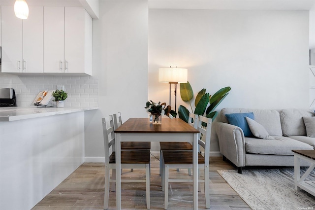 dining room featuring light hardwood / wood-style flooring