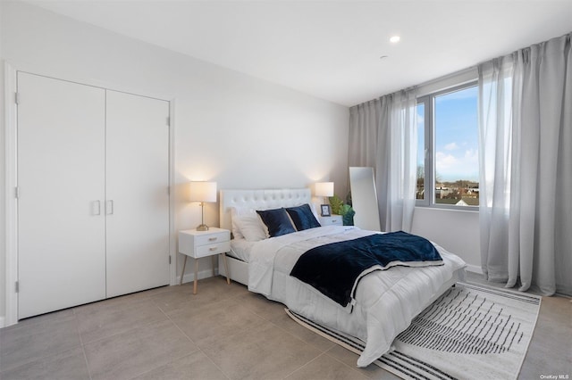 bedroom featuring light tile patterned floors