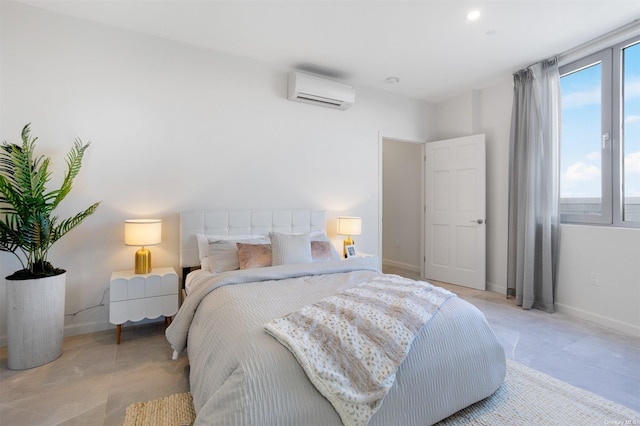 bedroom with an AC wall unit