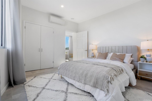 bedroom featuring a wall mounted AC and a closet