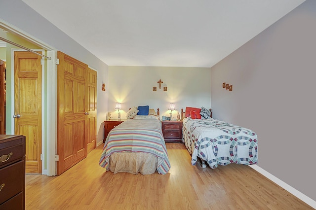 bedroom with light hardwood / wood-style flooring