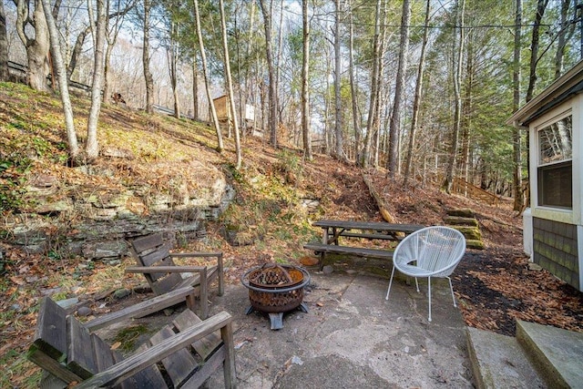 view of patio / terrace featuring an outdoor fire pit